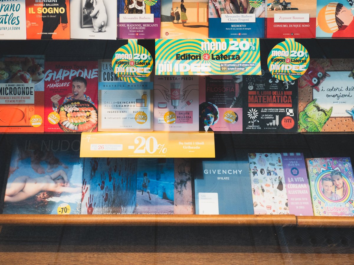 Shelves full of books and comics in a busy shop